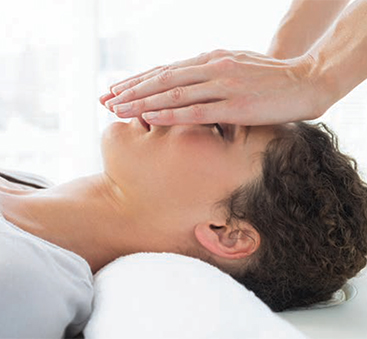 A photo of a Reiki master at work